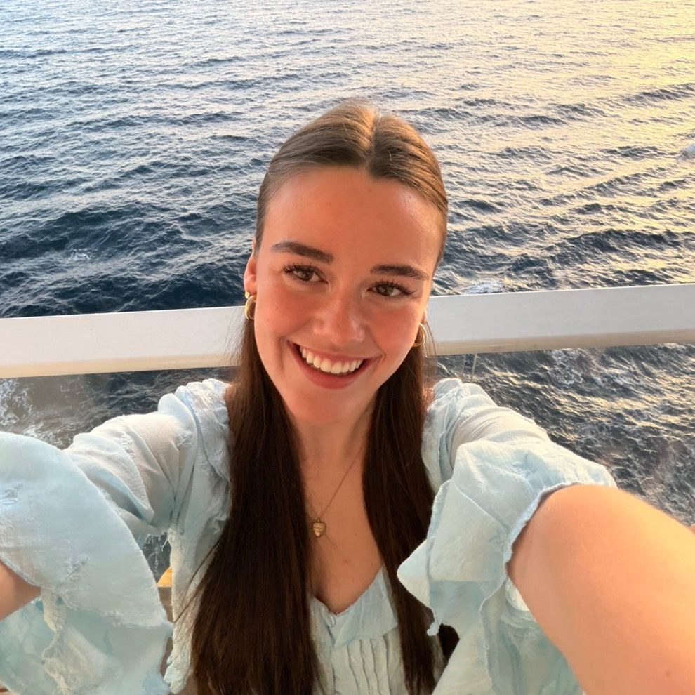 Brooke smiling by the ocean